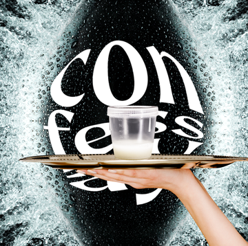 sperm sample collection in a clear cup resting on a silver platter